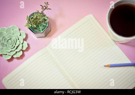 Blank Notebook with Coffee and Plants on Pink Background Stock Photo
