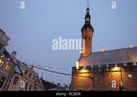 View of old town Tallinn Town Hall Square with holiday illumination at blue hour. Landmark of Estonia. Europe tourist attraction. Stock Photo