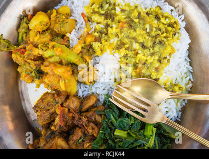 Traditional Nepali dal bhat served in metal plate Stock Photo