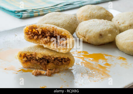 Stuffed Meatballs with Minced Meat icli kofte / Boiled kibbeh / Turkish Traditional Haslama Food Falafel in Plate. Stock Photo