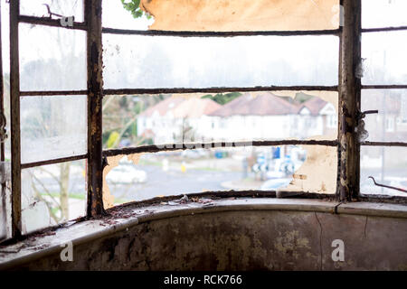 Close up of original metal window in derelict house built in 1930s deco style, Rayners Lane, Harrow UK. House is due for demolition. Stock Photo