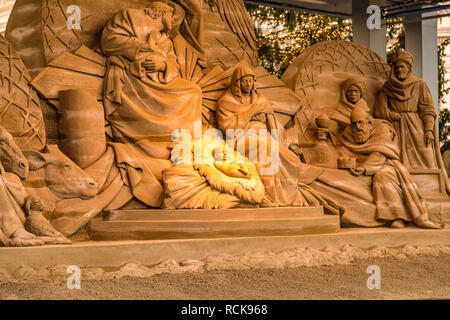 VATICAN - JANUARY 2, 2019: sunlight is enlightening Christmas sand Nativity Scene in Saint Peter Square in Vatican City Stock Photo