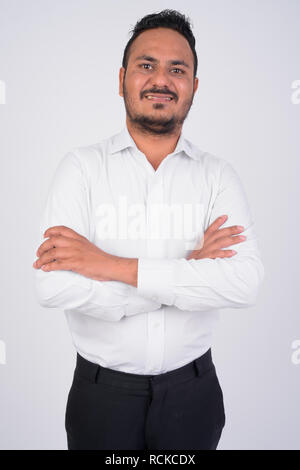 South Indian businessman standing with his arms crossed Stock Photo - Alamy