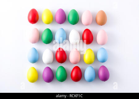 Easter holidays concept with colorful easter eggs pattern on white background Stock Photo