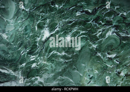 Awesome background of green natural stone marble with a white pattern, called Verde Venezia. Stock Photo