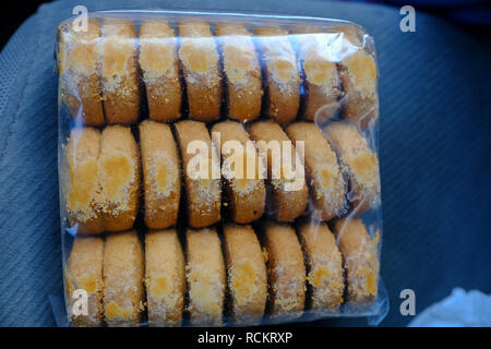 Bakery cookies in plastic bag packaging on car seat Stock Photo