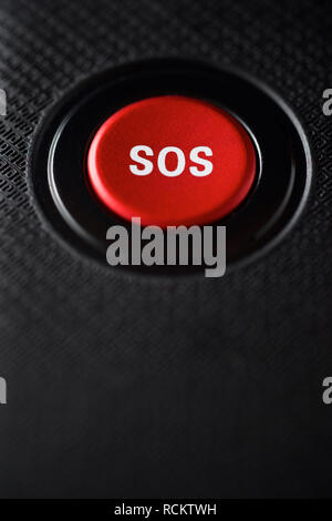 SOS button on an electronic device. Stock Photo