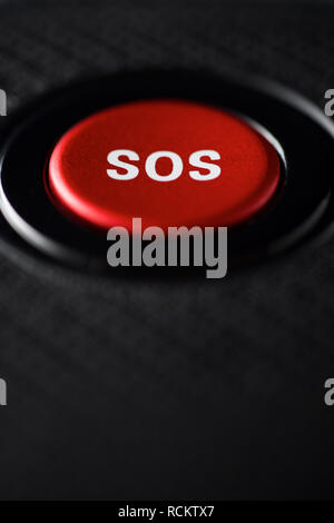 SOS button on an electronic device. Stock Photo