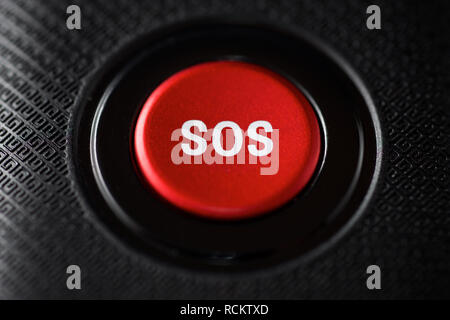 SOS button on an electronic device. Stock Photo