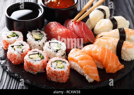 Variety of sushi food. nigiri, maki, uramaki and roll with tuna, salmon and shrimp. Traditional asian food with raw fish and rice. horizontal Stock Photo