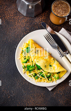 Omelette with green vegetable and cheese Stock Photo