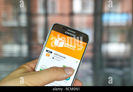 MONTREAL, CANADA - August 8, 2016 - AWS mobile app on screen of Samsung S7 in hand. Amazon AWS offers a suite of cloud-computing services that make up Stock Photo
