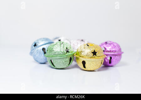 Group of Colorful painted pet small bells for cats and dogs on white background. Pet Shopping Product, Accessories, Animal Tracing Tools, Objects, Dec Stock Photo