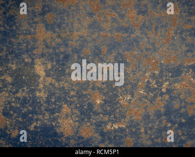 Corrosion texture on the blue metal surface of the old barrel Stock Photo