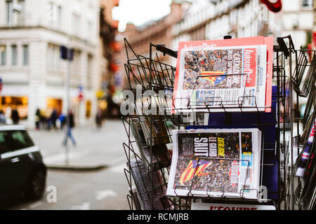 PARIS, FRANCE - OCT 28, 2017: French international Liberation and Le Figaro newspapers with news from Spain about the Catalonia Referendum and protests in Barcelona - kiosk stand in city  Stock Photo