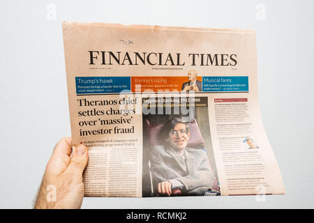 PARIS, FRANCE - MAR 15, 2018: POV at the International newspaper Financial Times  with portrait of Stephen Hawking the English theoretical physicist, cosmologist dead on 14 March 2018 Stock Photo