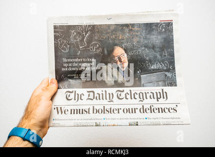 PARIS, FRANCE - MAR 15, 2018: POV at International newspaper The Daily Telegrph with portrait of Stephen Hawking the English theoretical physicist, cosmologist dead on 14 March 2018 Stock Photo