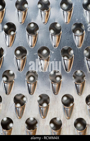 used metal cheese grater macro background texture image Stock Photo