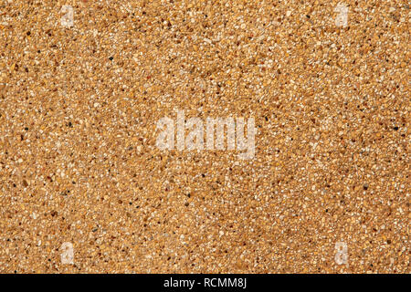 Exposed aggregate finish. Washed sand. Texture and background. Stock Photo