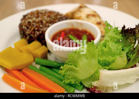 Closed Up Fresh and Boiled Vegetables with Spicy Shrimp Paste Dip, Thai Food Traditional Side Dish Stock Photo