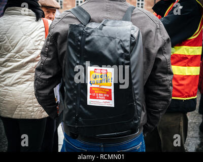 STRASBOURG, FRANCE  - MAR 22, 2018: Macron, a year is neough sticker on backpack at demonstration protest against Macron French government string of reforms, Stock Photo