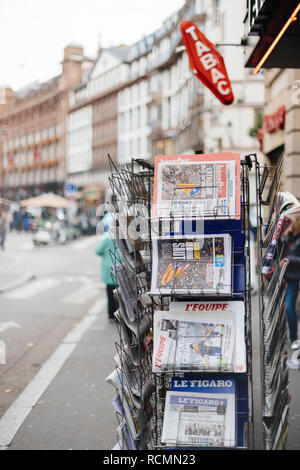 PARIS, FRANCE - OCT 28, 2017: French international newspaper with news from Spain about the Catalonia Referendum and protests in Barcelona - tabac kiosk stand in city  Stock Photo