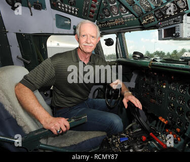 MIAMI, FL - NOVEMBER 17: Captain 'Sully' Sullenberger and Co-pilot Jeff Skiles pose with the Historical 1958 DC7 for a benefit hosted by Historical Flight Foundation. Chesley Burnett 'Sully' Sullenberger, III (born January 23, 1951) is a retired airline captain and aviation safety consultant. He was hailed as a national hero in the United States when he successfully executed an emergency water landing of US Airways Flight 1549 in the Hudson River off Manhattan, New York City, after the aircraft was disabled by striking a flock of Canada geese during its initial climb out of LaGuardia Airport o Stock Photo