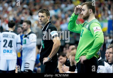 16 January 2019, Berlin: Handball: WM, Germany - France, preliminary round, group A, 4th matchday. Germany coach Christian Prokop (l) and goalkeeper Andreas Wolff are on the sidelines. The game ended with 25:25. Photo: Kay Nietfeld/dpa Stock Photo