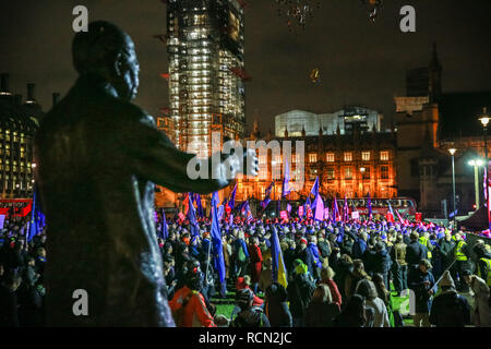 Westminster, London, UK, 15th Jan 2019. 'The People's Vote' rally is attended by protesters in Parliament Square. Nelson Mandela statue in the foreground. Pro and Anti Brexit protesters rally in Parliament Square and at the Houses of Parliament in Westminster ahead of and during the vote on Theresa May's Brexit deal. Credit: Imageplotter News and Sports/Alamy Live News Stock Photo