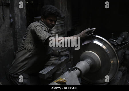 January 16, 2019 - Dhaka, Bangladesh - A worker making silver kitchen accessories at a workshop on hazard condition for low wages near Kamrangir Char. (Credit Image: © MD Mehedi Hasan/ZUMA Wire) Stock Photo