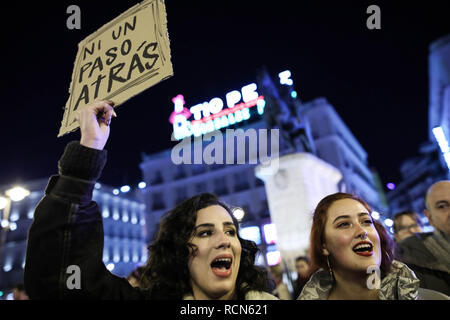 A woman seen chanting slogans while holding a placard saying Not a step back during the protest. Women gathered at Puerta del Sol in Madrid to protest against Vox, the far-right Spanish political party who repealed legislation on combating violence against women. Stock Photo