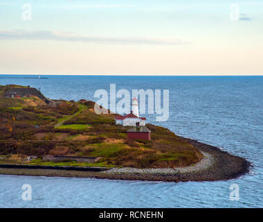 The lighthouse on Georges Island in Halifax Harbor, Nova Scotia was built in 1917 and is operated by the Canadian Coast Guard. Stock Photo