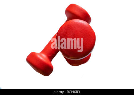 Two red dumbbells isolated on white background. View from above Stock Photo