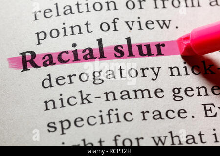 Fake Dictionary, Dictionary definition of the word racial slur. including key descriptive words. Stock Photo