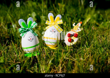 Easter eggs cute bunny on trendy pink background. Funny decoration. Happy Easter Handmade Springtime. Holiday background.Festive concept.Easter bunny decoration.DIY holiday handicraft of colorful rabbits Stock Photo