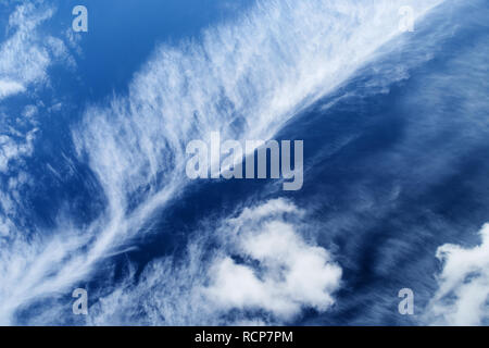 Cloudscape with with stratocumulus clouds on the blue sky. Stock Photo