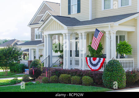 Row of Homes Flying the American Flag Stock Photo