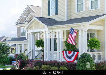 Row of Homes Flying the American Flag Stock Photo