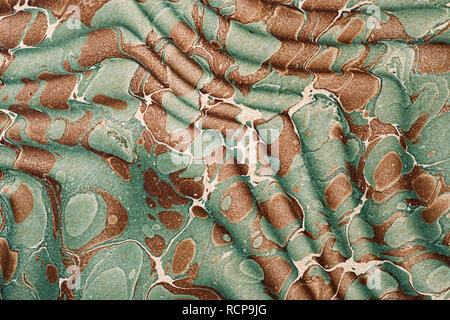 vintage brown and blue marbled paper background texture from an antique book endpaper Stock Photo