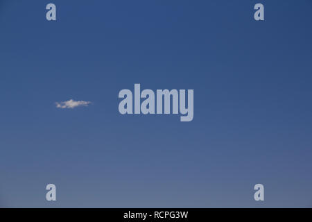 a lonely cloud in the blue sky Stock Photo