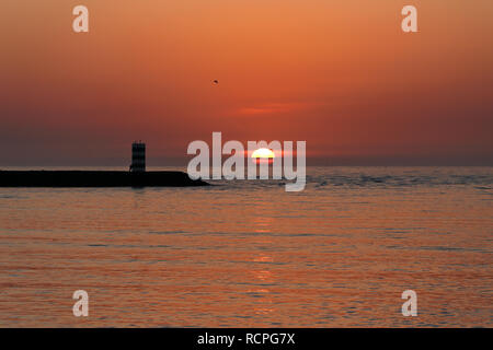 Ocean north pier of Douro river mouth at sunset, Porto, Portugal Stock Photo