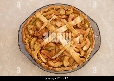 homemade yellow and green apple pie with just a few strips of top crust Stock Photo