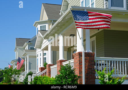 Row of Homes Flying the American Flag Stock Photo