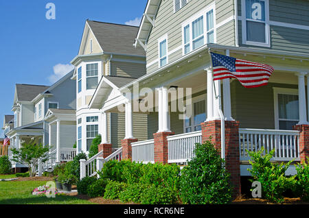 Row of Homes Flying the American Flag Stock Photo