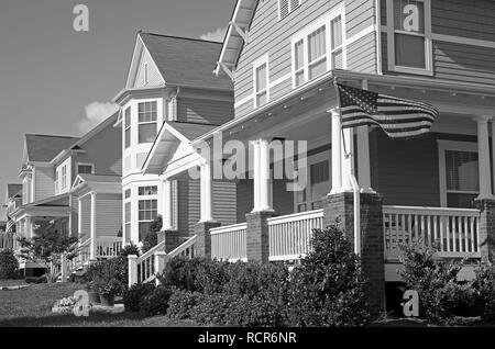 Row of Homes Flying the American Flag Stock Photo