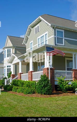 Row of Homes Flying the American Flag Stock Photo