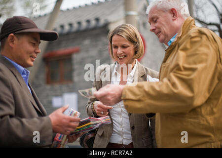 Happy couple visiting a street market. Stock Photo