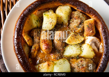 Open Pie with Potatoes and different kinds of meat Stock Photo