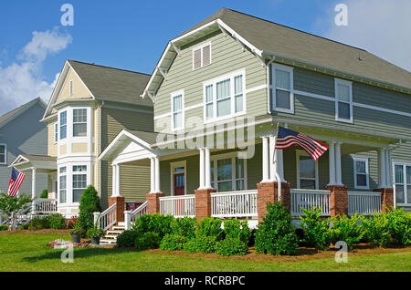 Row of Homes Flying the American Flag Stock Photo