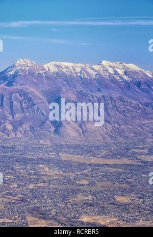 Aerial view of Wasatch Front Rocky Mountain landscapes on flight over Colorado and Utah during winter. Grand sweeping views near the Great Salt Lake, Stock Photo